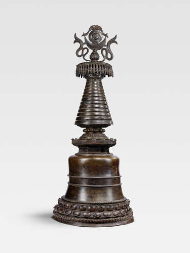 A LARGE COPPER ALLOY MAHAPARINIRVANA STUPA   TIBET, CIRCA 14TH CENTURY