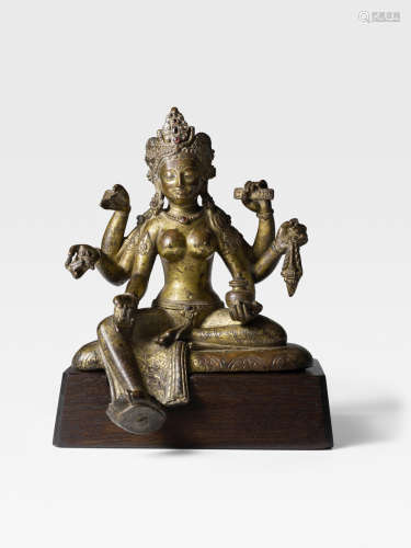 A GILT COPPER FIGURE OF VASUDHARA  NEPAL, CIRCA 11TH CENTURY