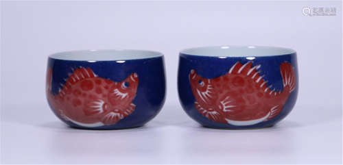 PAIR OF CHINESE BLUE GLAZE RED UNDER GLAZE FISH CUPS