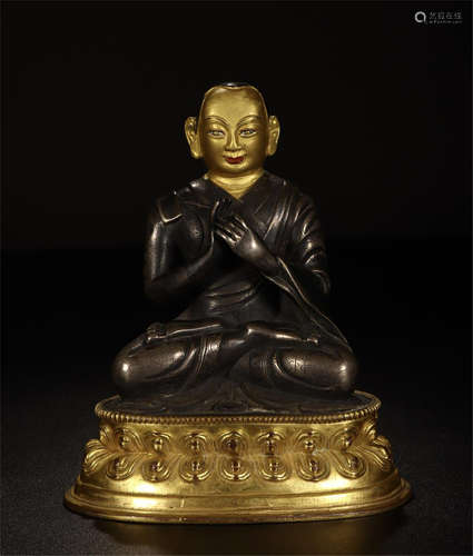 TIBETAN PARTLY GILT BRONZE SEATED BUDDHA