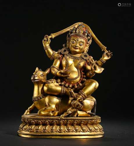 TIBETAN GILT BRONZE SEATED BUDDHIST GUARDIAN ON HORSE