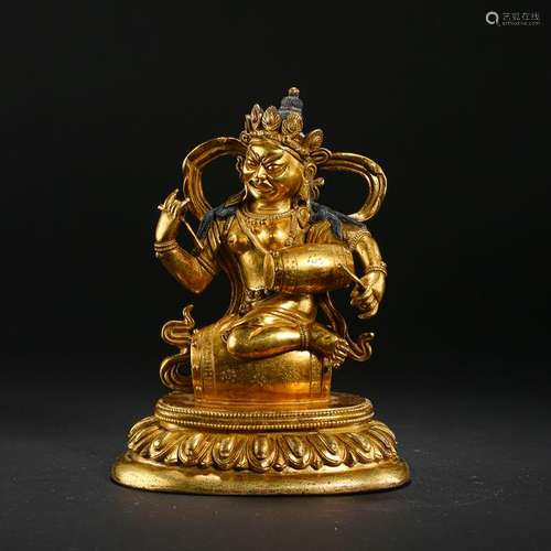 TIBETAN GILT BRONZE BUDDHA WITH DRUM