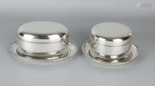 Beautiful couple with silver cookie boxes and saucers,