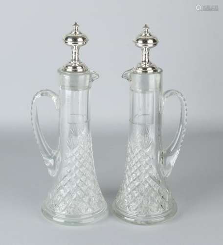 Set of carafes with silver, two crystal carafes with
