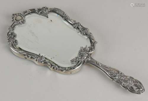 Hand mirror with silver bezel. Facet-cut hand mirror