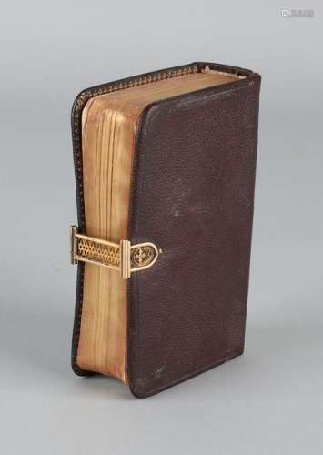 Small bible with a brown leather cover, with the new