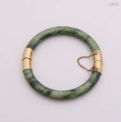 Jade bracelet with gold-plated hinge and safety lock.