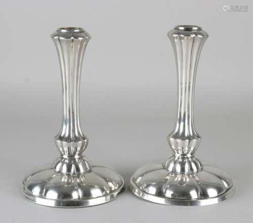 Pair of silver candlesticks, 835/000, on a round base