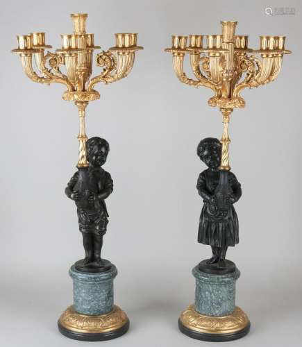Two capital bronze Empire-style candle holders with