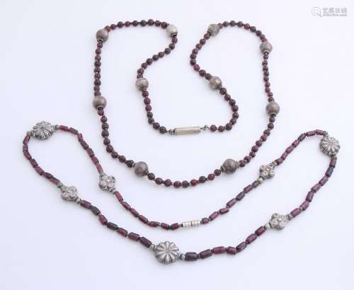 Two necklaces with garnet, One necklace of round cut