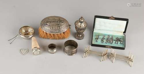 Lot of silverware with table brush with depiction, a