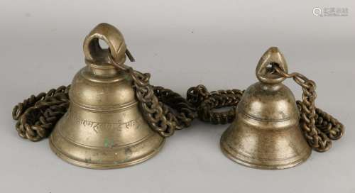 Two large Eastern bronze bells on bronze chains.