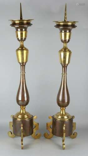 Two large 19th century brass candle holders. Partially