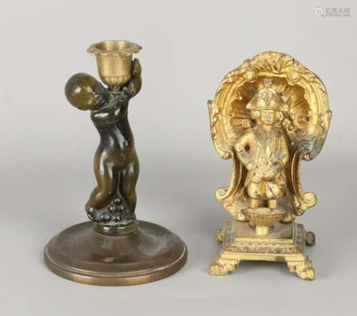 Two antique figures. Circa 1900. One candle holder with