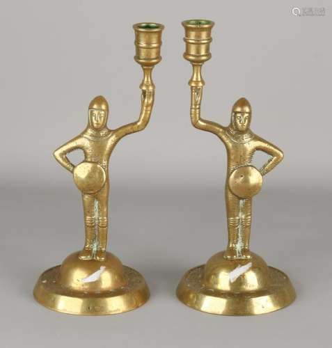 Two antique brass candle holders. Knights. Around 1920.