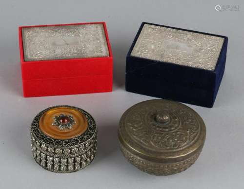 Four oriental lid boxes made of metal + brass. 20th