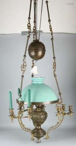 Large antique brass hanging petroleum lamp with candle