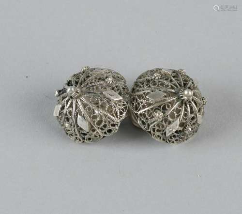 Antique silver throat buttons, constructed from