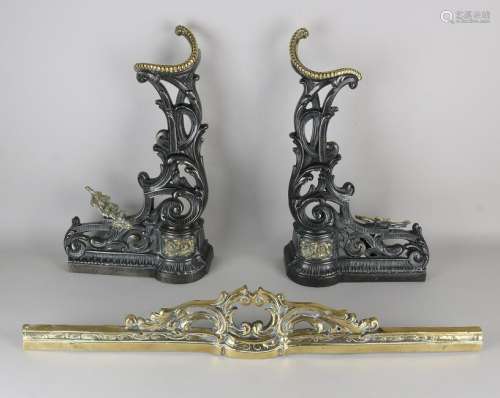 19th century cast iron with brass fireplace cover.