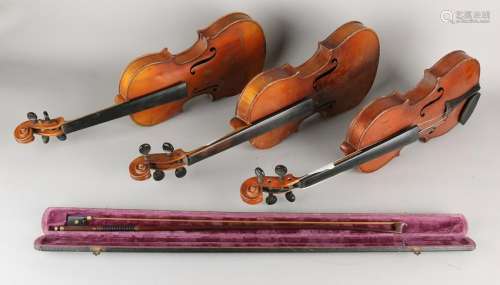 Three old / antique violins + bow. 20th century. Twice