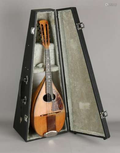 Antique mandolin in later suitcase. Around 1920.
