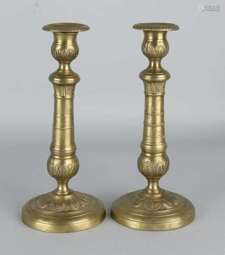 Two 19th century brass Empire candle holders.