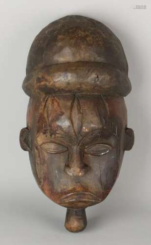 Old African wood stabbed mask. Dimensions: 36 x 13 x 20