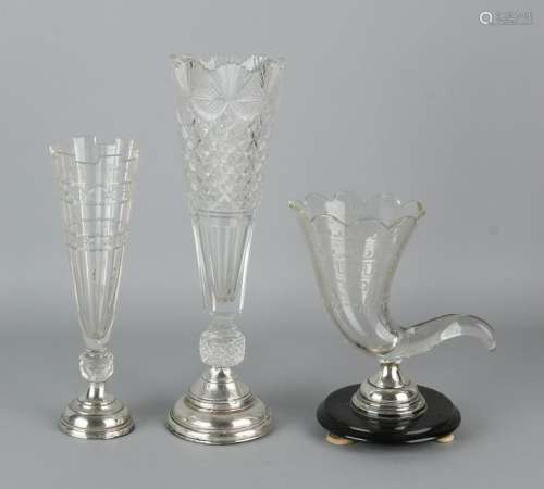 Three pieces of crystal with silver, two silver vases