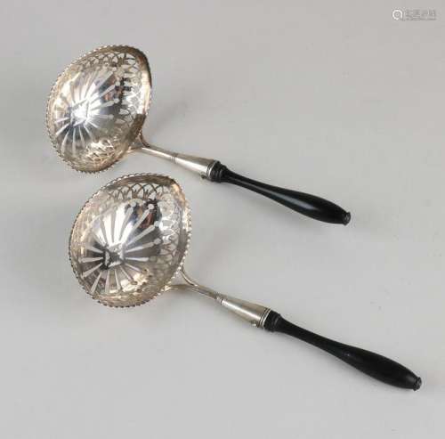 Two identical silver scoop spoons, 833/000, with a