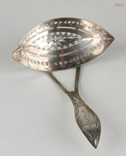 Silver scattering spoon with barge-shaped bowl with