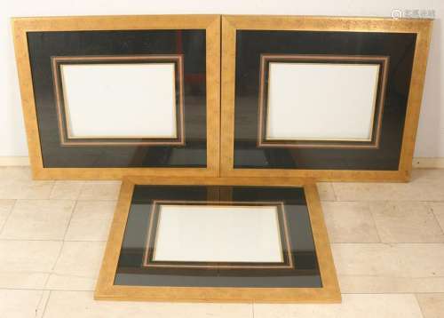 Three old gold-colored frames with passe partout +
