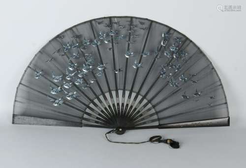 Beautiful black fan with floral engravings and a cloth
