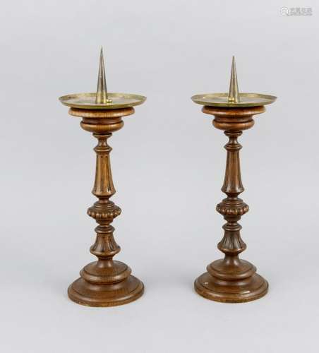 Two 19th century wooden candle holders with brass drip