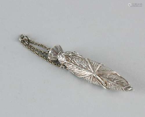 Special silver perfume bottle. Flacon as a rolled petal