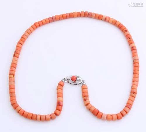 Blood coral necklace, with an orange color, attached to