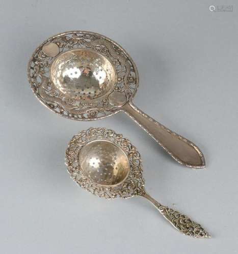 Two silver tea strainers. Chinese tea strainer with