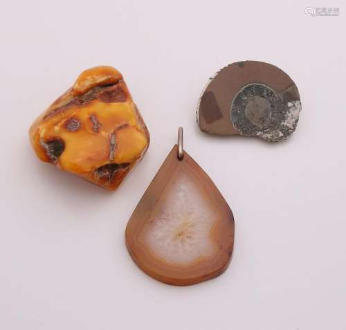 Three stones, a disc agate with a pendant eye, a lump