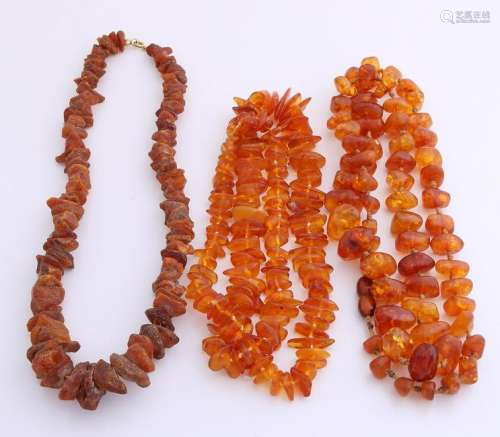 Three necklaces of amber, a necklace with rough beads