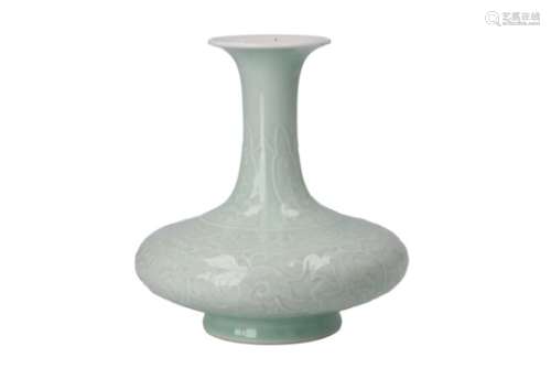 A celadon glazed porcelain vase, decorated in relief with flowers. Unmarked. China, 20th century. H.