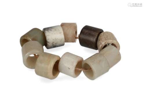 A collection of ten jade thumb rings. China. Provenance: bought in China, 1978.