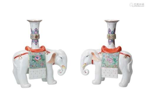 A pair of polychrome porcelain candle sticks in the shape of elephants. Unmarked. China, 20th