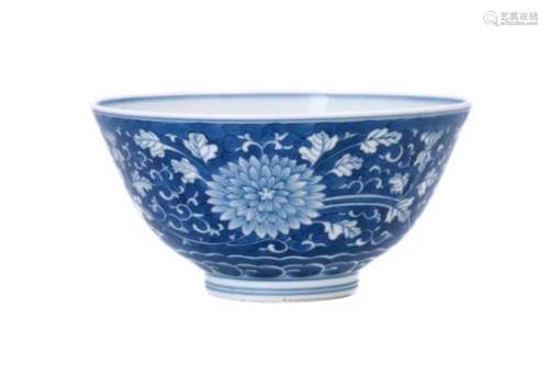 A blue and white porcelain bowl, decorated with flowers. Marked with 6-character mark Kangxi. China,