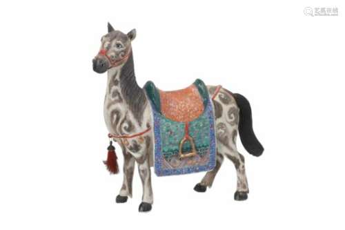 A polychrome porcelain sculpture of a horse with saddle and tassle. Unmarked. China, 19th century.