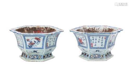 A pair of blue and underglaze red hexagonal porcelain flower pots, decorated with reserves depicting