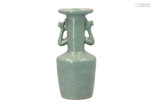 A celadon glazed porcelain vase with two handles in the shape of mythical animals. After Song