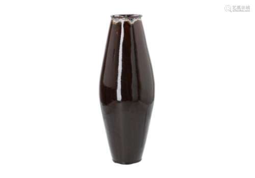 An olive shaped black glazed porcelain vase. Marked with 4-character mark Kangxi. China, 19th