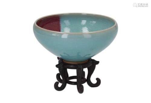 A jun ware porcelain bowl on wooden base, with splash decor. After Song example. Unmarked. China,