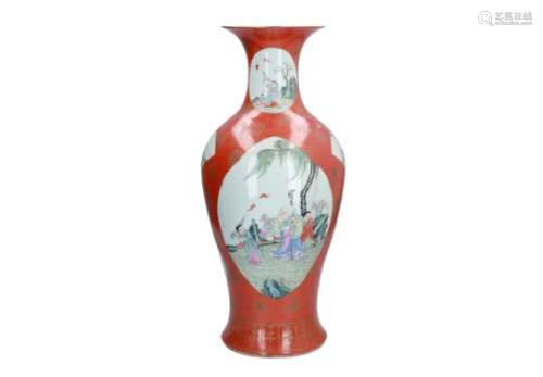 A coral red and gilded porcelain vase with polychrome reserves, depicting figures and little boys in