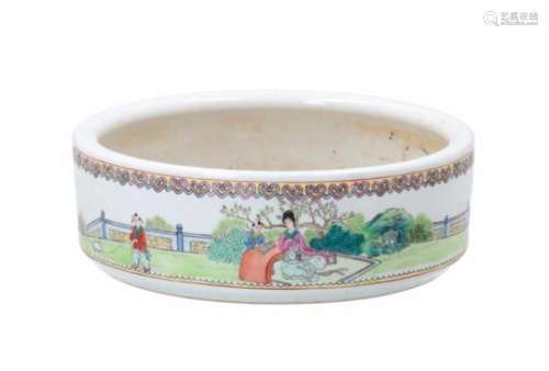A polychrome porcelain chrysanthemum bowl, decorated with figures in a garden and characters. Marked