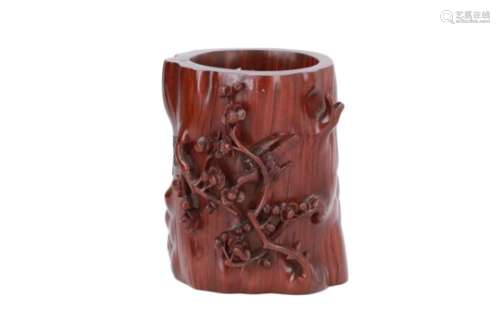 A rosewood brush pot, decorated in relief with a bird on flower branches and characters. Made by Xue